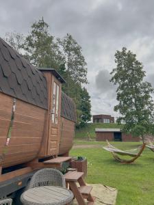 a wooden boat sitting on the back of a truck at Annsmuiža in Salacgrīva