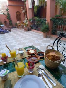 a table with food and drinks on top of it at Ryad Fnina in Tiznit