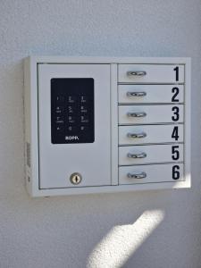 a clock on the wall with numbers on it at Casa Carmela in Solothurn