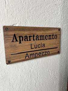 a sign on a wall that readsarmazona ludota at Appartamento Lucia in Ampezzo +1 photo