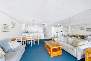 a living room with a couch and a dining room at Carousel 1905 in Ocean City