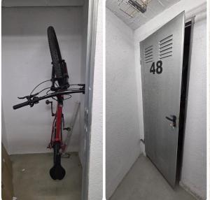 a bike parked in a room next to a door at Font de Ferro 2 HUT 6755 in Ransol