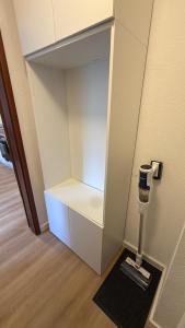 a small white refrigerator with its door open at Heimathafen Neumünster in Neumünster