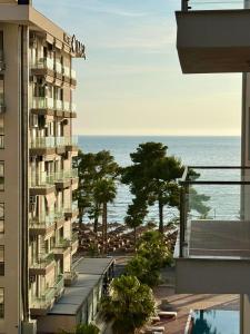 a view of the ocean from a building at SunSis Apartment in Shëngjin