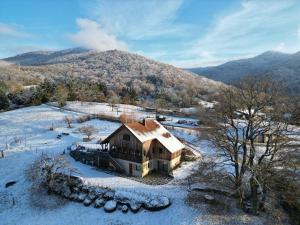 an aerial view of a house in the snow at Le chalet du Chardonneret in Soultzbach-les-Bains