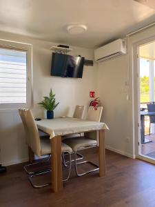 a dining room with a table and chairs at Floating house Sunflower in Pula