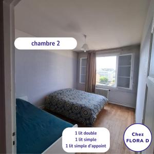 a small room with a bed and a window at Chez FLORA D - Lisieux hypercentre - in Lisieux