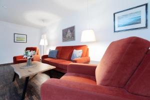 a living room with two chairs and a couch at Gut Staberhof Staberpark in Staberdorf