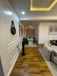a living room with a couch and a table at Precious home apartment II in Lekki +1 photo
