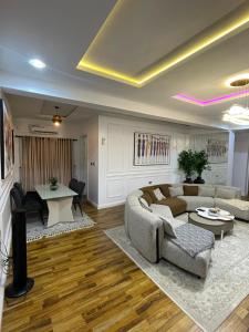 a living room with a couch and a table at Precious home apartment II in Lekki