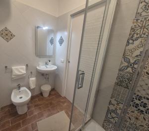 a bathroom with a shower and a toilet and a sink at Affittacamere Le Fontane in Altopascio