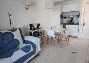 a bedroom with a bed and a table and chairs at Roby&Vito Vista Taurito in Taurito +25 photos