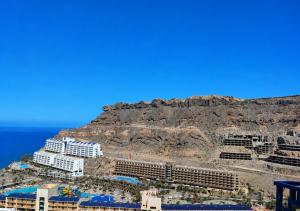 an aerial view of a resort on the side of a mountain at Roby&Vito Vista Taurito in Taurito