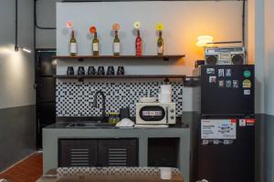 a toy kitchen with a sink and a refrigerator at Judy house Betong in Betong