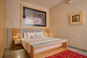 a bedroom with a large bed in a room at Casa Carmen Reforma in Oaxaca City