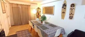 a room with a table with a black and white table cloth at Sesimbra Sea Apartment with Pool & Gym near Lisbon in Sesimbra