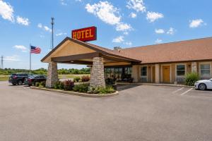 a hotel with a sign in a parking lot at Segovia Lodge Junction TX I -10 in Junction