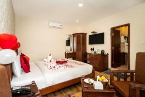 a hotel room with a bed and a living room at The Culture Resort in Pokhara