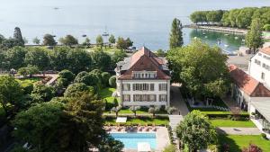 an aerial view of a house with a swimming pool at Hotel Angleterre in Lausanne