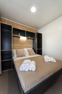 a bedroom with a large bed with towels on it at Casa Mare Drage in Drage +75 photos
