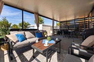 a living room with a couch and a table at Casa Mare Drage in Drage