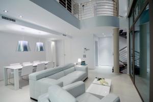 a living room with a couch and a table at Altea Hills Luxury Villas in Altea