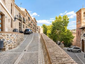 a street in an old town with buildings at Capricho Toledano, Apartamento con terraza en el centro histórico in Toledo