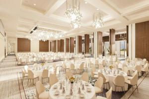 a banquet hall with white tables and chairs and chandeliers at Sheraton Uşak Hotel & Thermal Spa in Uşak +176 photos