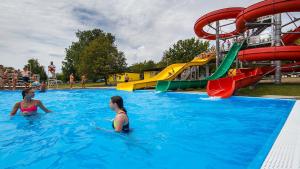 two women in the water at a water park at Villasobota in Rimavská Sobota
