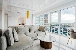 a living room with a couch and a table at J&K Platinum Towers in Warsaw