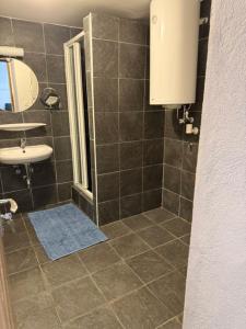 a bathroom with a shower and a sink at Thomas in Judenburg