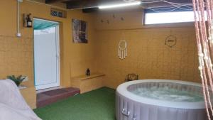 a bathroom with a large tub in a room at Villa las rosas in Agaete