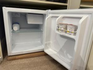 an open white refrigerator with its door open at Black Drove Farm in Twenty +11 photos