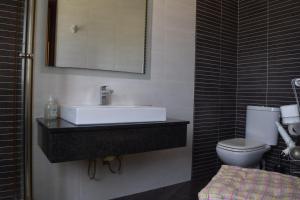 a bathroom with a sink and a toilet at Gmiel in-Natura B&B in Għajn il-Kbira +30 photos