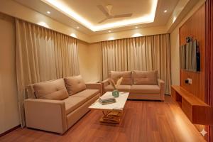 a living room with a couch and a table at Sawarthia Sewa Sadan, Ayodhya in Ayodhya