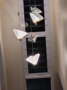 a group of butterflies hanging from a window at Crocus Corner - Kyalami in Kyalami