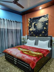 a bedroom with a bed with a poster on the wall at The nomadics nest in Bhadarwāh