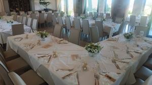 a set of tables and chairs in a banquet hall at Agriturismo Mamma Maria in Montefiascone