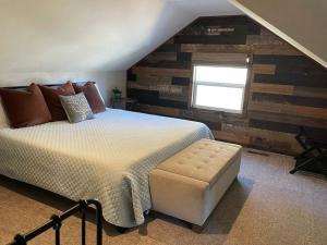 a bedroom with a large bed and a window at THE OHANA at BIG BEAR in Big Bear City