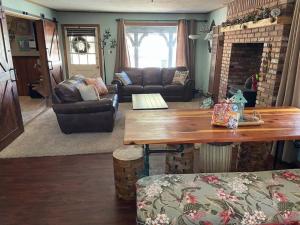 a living room with a couch and a table at THE OHANA at BIG BEAR in Big Bear City +32 photos