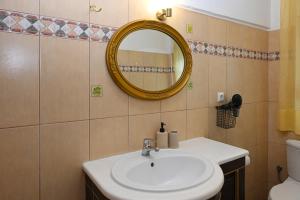 a bathroom with a sink and a mirror at Sunrise Horizon in Iraklitsa +32 photos