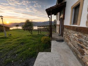 a stone building with a sunset in the background at Old Stead Villa in Kŭrdzhali