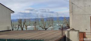 a view of the water from a balcony of a house at Civico 95 Alloggio Turistico in Marta +21 photos
