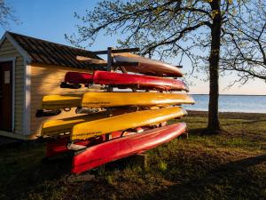 a group of surfboards stacked on top of a building at Klintehamn Rooms - Near the Sea in Klintehamn