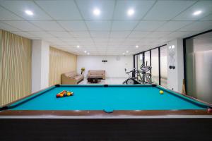 a billiard room with a pool table at Behomy J-Home Bandung in Bandung