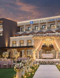 a wedding venue with tables and chairs and a hotel at Riviera Hotel and Resort in Choli +114 photos