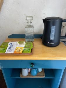 a table with a coffee maker and a blender on it at Chateau de Bouquetraud in Franchesse