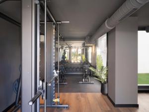 a fitness room with a bench and a plant at Meral Units in Fuengirola