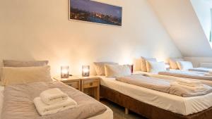 a room with two beds with towels on them at URBAN FLATS Berlin in Berlin