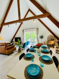 a large living room with a table and chairs at Villa Everbeur te Averbode in Scherpenheuvel-Zichem